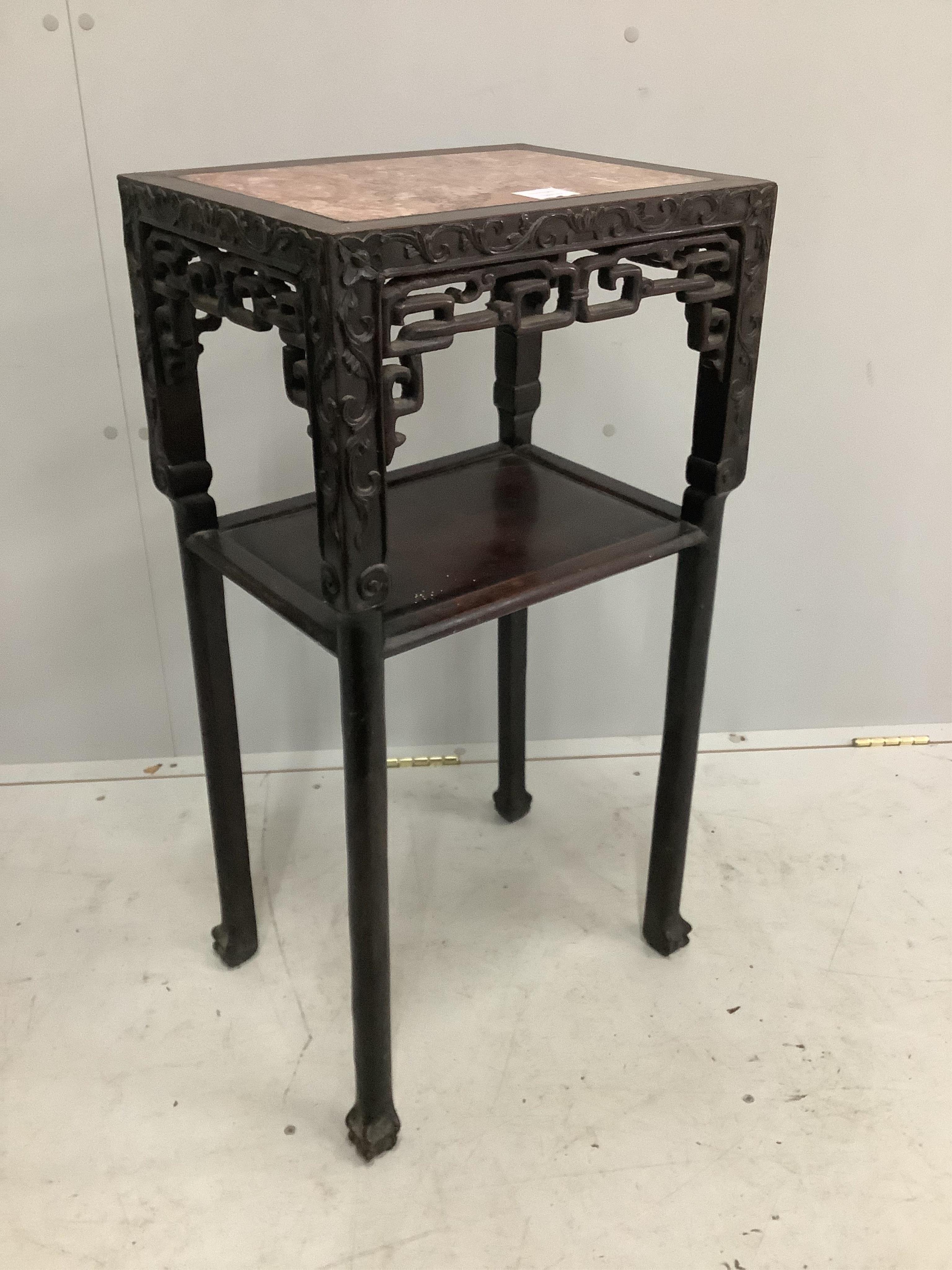 A Chinese carved hardwood urn stand, width 42cm, depth 32cm, height 81cm. Condition - fair